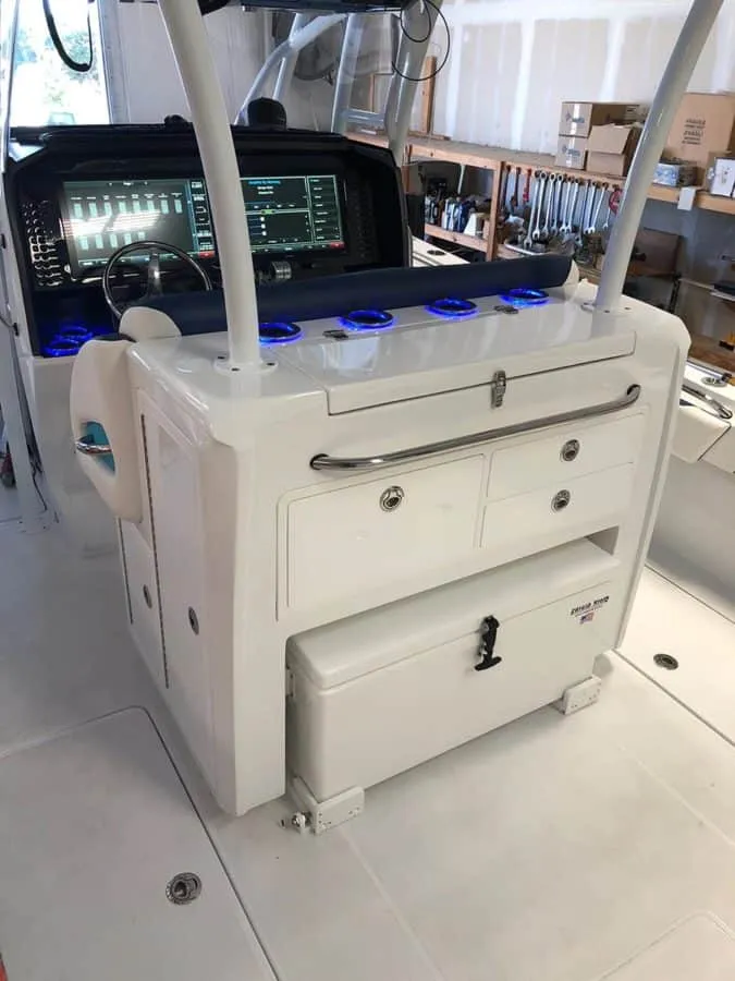 Slide: The Image of 2023 Nor-Tech 392 Super Fish boat console with advanced navigation system and storage compartments. - 9