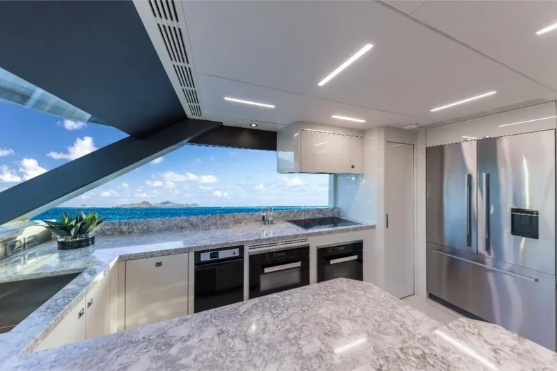 Slide: The Image of Modern kitchen on 2023 Ocean Alexander 35R yacht with ocean view. - 23