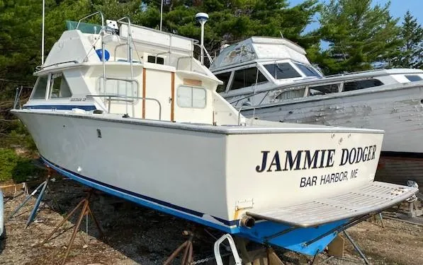 The Image of 1972 Bertram Express boat named "Jammie Dodger" in Bar Harbor, Maine, on dry dock. - 0