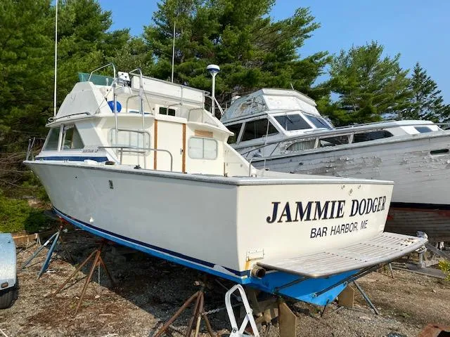 Slide: The Image of 1972 Bertram Express boat named "Jammie Dodger" in Bar Harbor, Maine, on dry dock. - 21