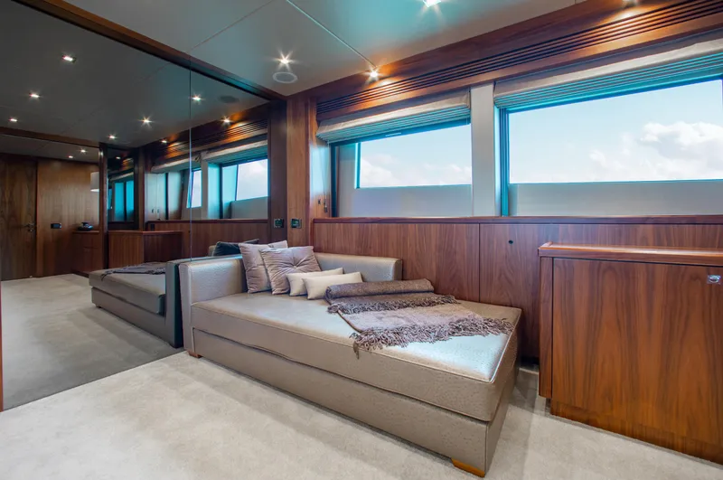 Slide: The Image of Luxurious interior of 2014 Sunseeker 131 yacht with modern furnishings and large windows. - 16