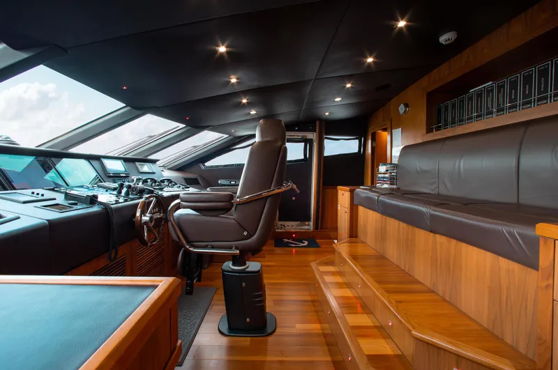 Slide: The Image of Interior of 2014 Sunseeker 131 yacht's helm station with leather seating and advanced controls. - 29