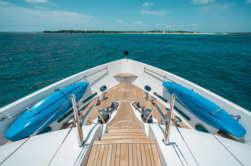 Slide: The Image of Bow of 2014 Sunseeker 131 yacht with blue kayaks on open sea. - 31