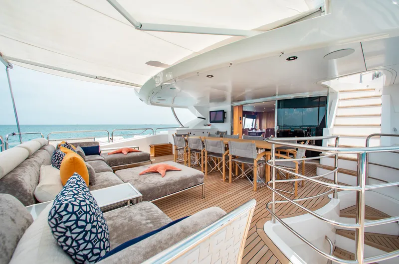 Slide: The Image of Luxurious deck of 2014 Sunseeker 131 yacht with plush seating and dining area. - 33