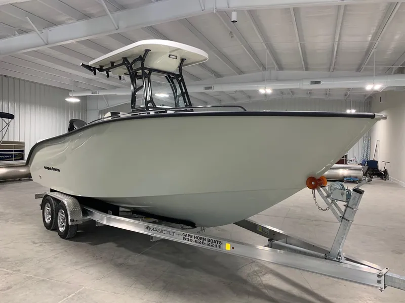 Slide: The Image of 2024 Cape Horn 22 OS boat on trailer in indoor showroom. - 1