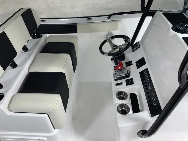 Slide: The Image of 2024 Cape Horn 22 OS boat interior with dual seats and steering console. - 13