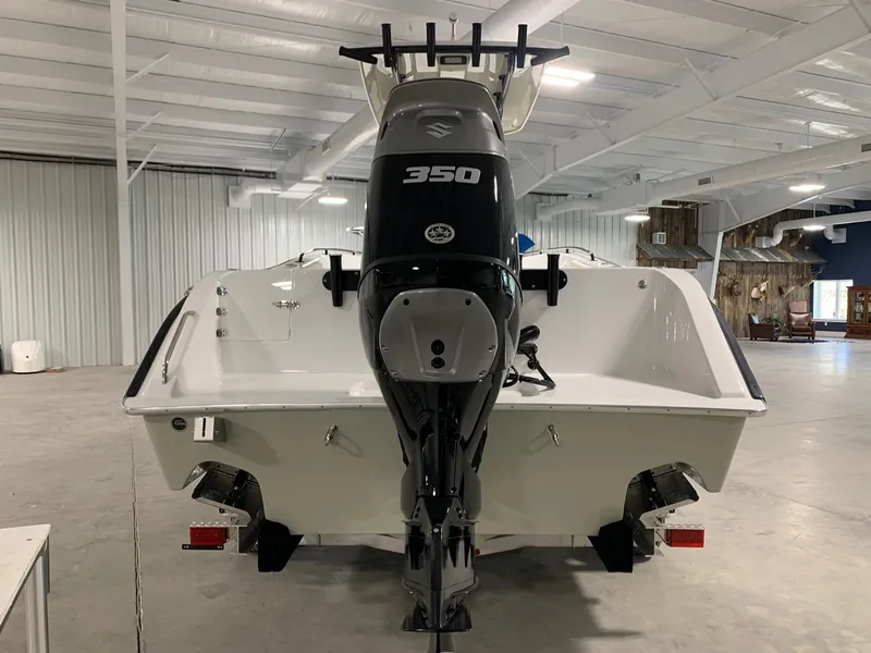 Slide: The Image of 2024 Cape Horn 22 OS boat with Suzuki 350 outboard motor in indoor showroom. - 3