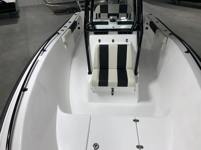 Slide: The Image of 2024 Cape Horn 22 OS boat interior with black and white seating. - 5
