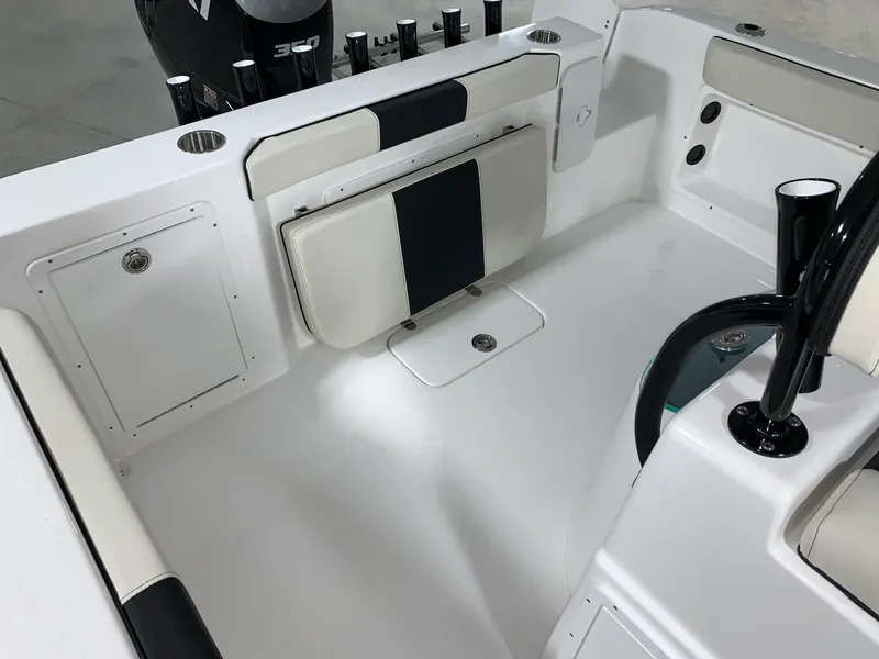 Slide: The Image of 2024 Cape Horn 22 OS boat interior with foldable seating and storage compartments. - 9
