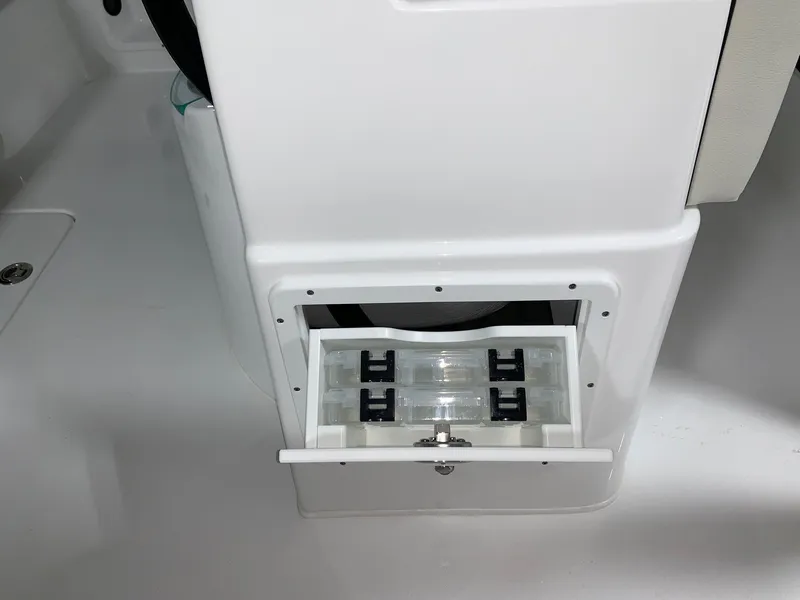 Slide: The Image of 2024 Cape Horn 22 OS boat storage compartment with open drawer. - 12