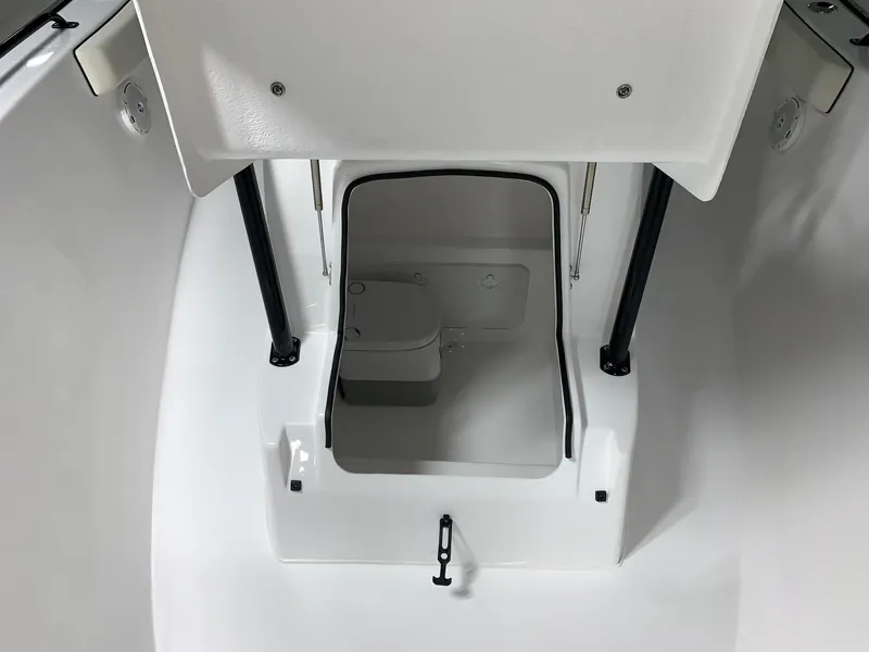 Slide: The Image of 2024 Cape Horn 22 OS boat interior with a compact marine toilet. - 15