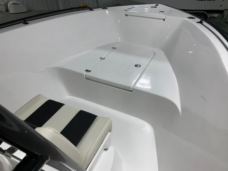Slide: The Image of 2024 Cape Horn 22 OS boat interior with seating and storage compartment. - 18