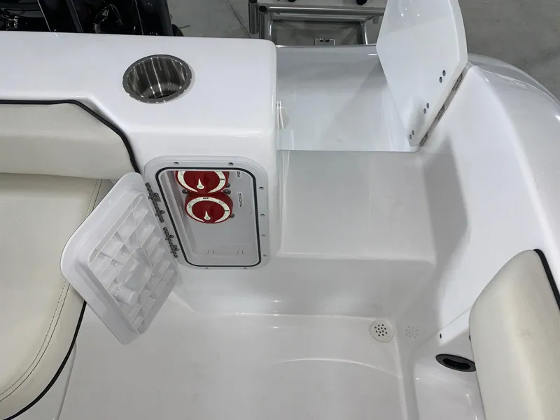 Slide: The Image of 2024 Cape Horn 22 OS boat interior, featuring seating and storage compartments. - 21