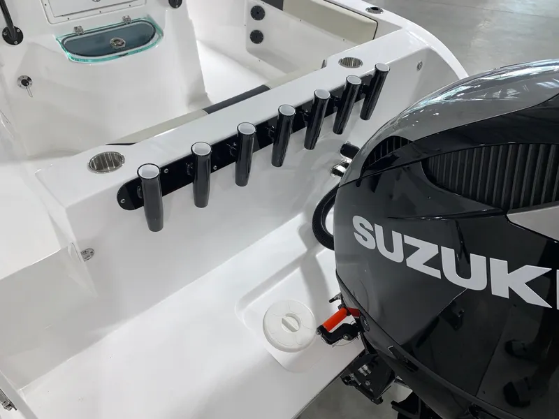Slide: The Image of 2024 Cape Horn 22 OS boat with Suzuki outboard motor and rod holders. - 6