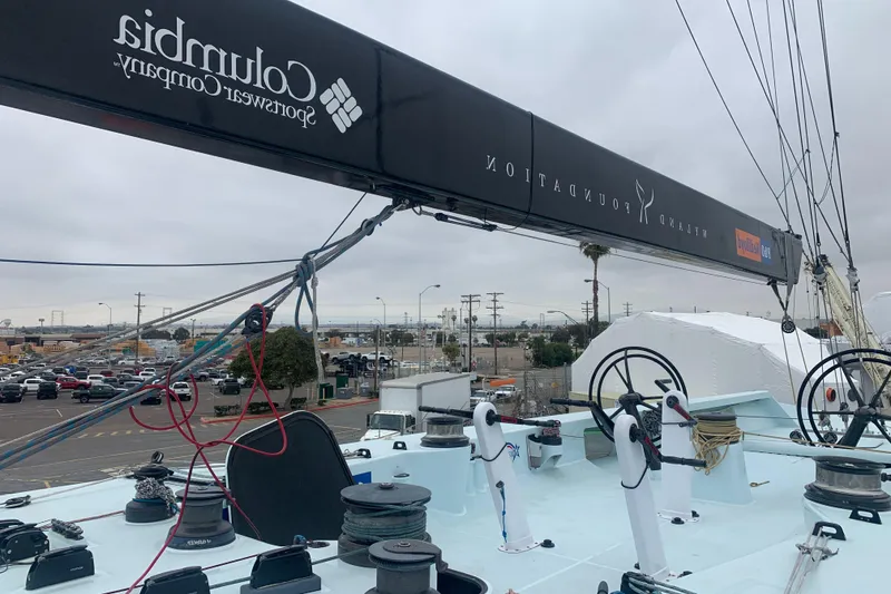Slide: The Image of Custom 2000 Americas Cup Class 75 yacht deck with winches and rigging. - 12