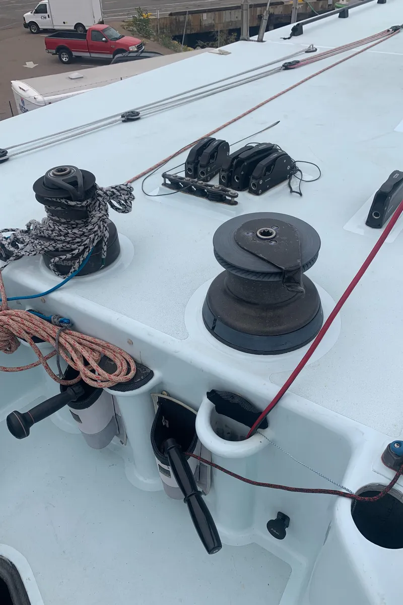 Slide: The Image of Deck of 2000 Custom Americas Cup Class 75 yacht with winches and ropes. - 13