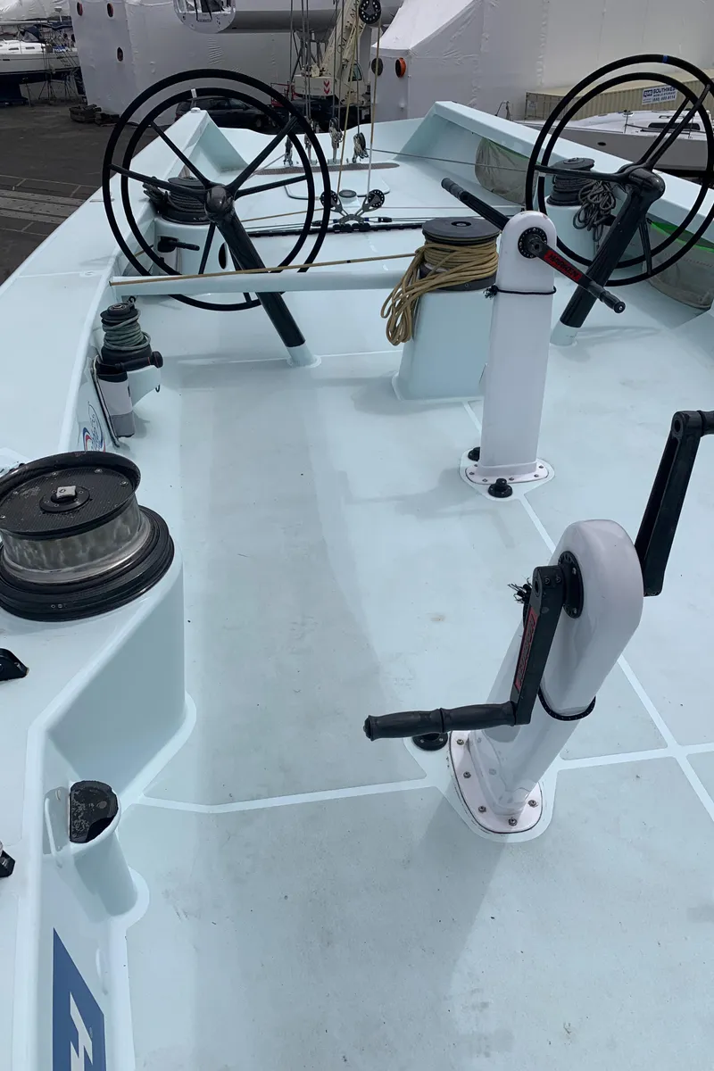 Slide: The Image of Deck view of 2000 Custom Americas Cup Class 75 yacht with steering wheels and winches. - 15