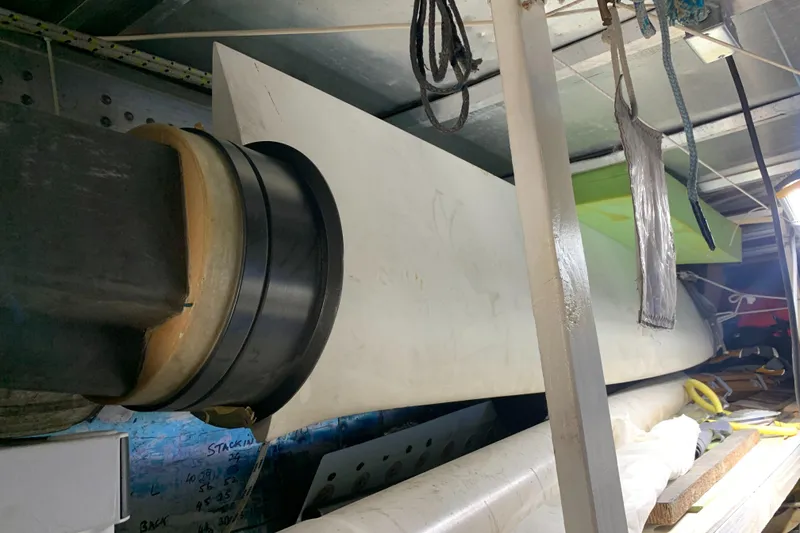 Slide: The Image of Close-up of a 2000 Custom Americas Cup Class 75 yacht component in storage. - 17