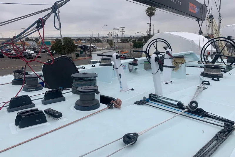 Slide: The Image of Deck of 2000 Custom Americas Cup Class 75 yacht with winches and steering wheels. - 25