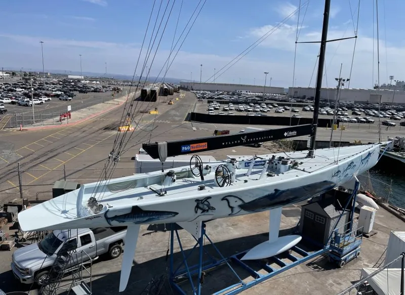 Slide: The Image of Custom 2000 Americas Cup Class 75 yacht on display at a shipyard. - 3