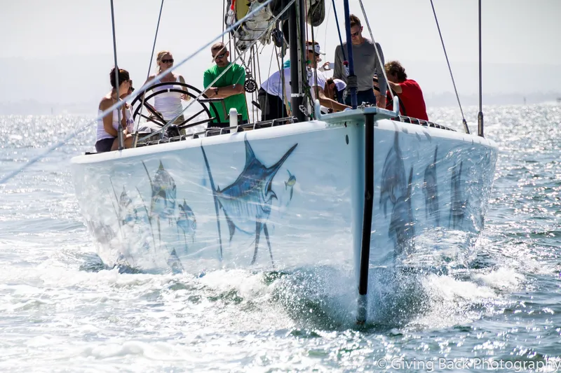 Slide: The Image of Sailing yacht "Americas Cup Class 75" with ocean-themed hull design, 2000 model, on the water. - 6