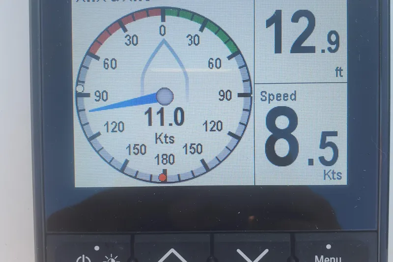 Slide: The Image of Boat instrument panel displaying wind angle, speed, and depth; Excess 12, 2020 model. - 13
