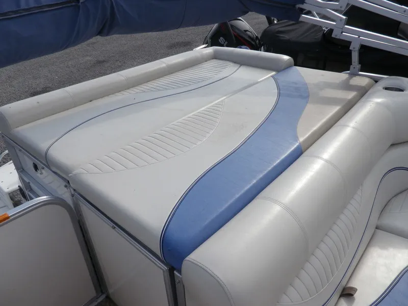 Slide: The Image of 2006 South Bay 925 boat with white and blue cushioned seating. - 10