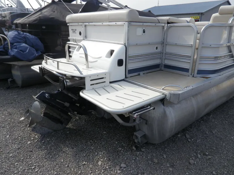 Slide: The Image of 2006 South Bay 925 pontoon boat rear view with outboard motor. - 3
