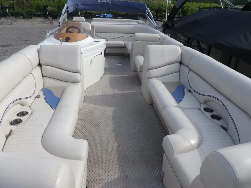 Slide: The Image of Interior of a 2006 South Bay 925 pontoon boat with spacious seating. - 4