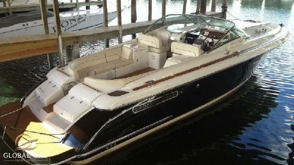 The Image of 2006 Chris-Craft 36 Corsair Heritage boat docked in marina, elegant design and spacious seating. - 0