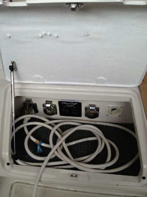 Slide: The Image of Storage compartment of 2006 Chris-Craft 36 Corsair Heritage with coiled hose. - 30