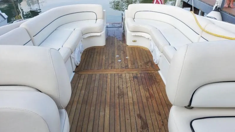 Slide: The Image of Luxurious 2006 Chris-Craft 36 Corsair Heritage boat with elegant teak deck and plush seating. - 36