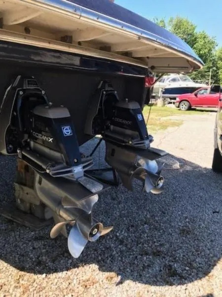Slide: The Image of 2006 Chris-Craft 36 Corsair Heritage boat with dual propellers in a parking area. - 40