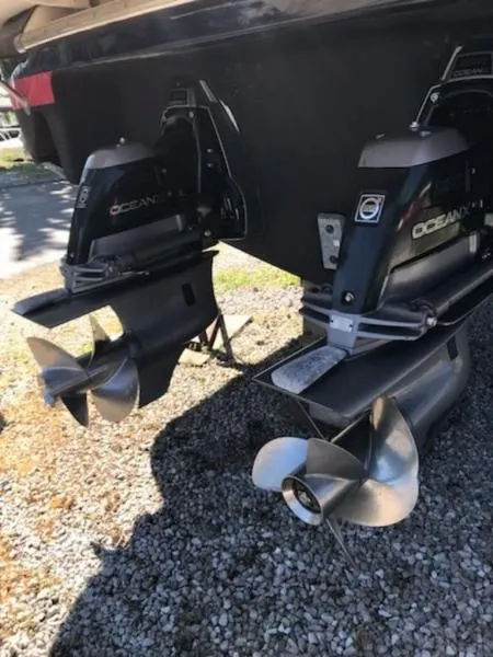 Slide: The Image of 2006 Chris-Craft 36 Corsair Heritage boat propellers on gravel surface. - 42