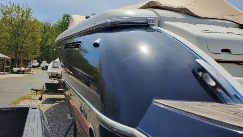 Slide: The Image of 2006 Chris-Craft 36 Corsair Heritage boat, sleek design, parked outdoors. - 44