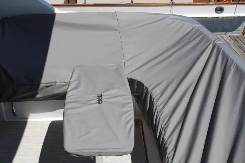 Slide: The Image of Gray cover on 2020 Tiara Yachts C49 Coupe deck, protecting seating area. - 10