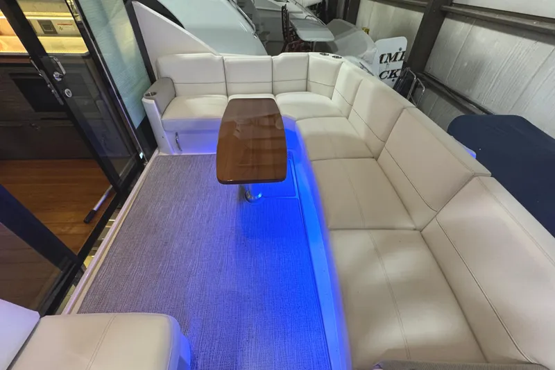 Slide: The Image of Luxurious interior of 2020 Tiara Yachts C49 Coupe with elegant seating and ambient lighting. - 11