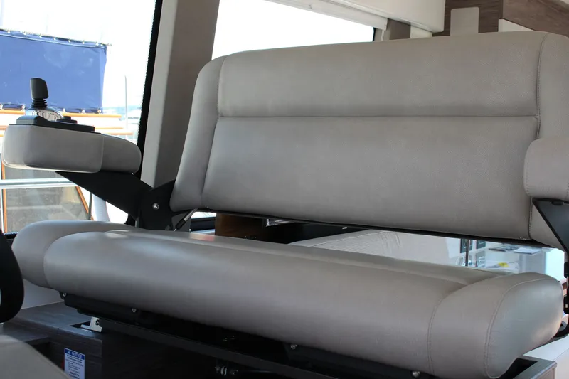 Slide: The Image of 2020 Tiara Yachts C49 Coupe interior helm seat with joystick control. - 18