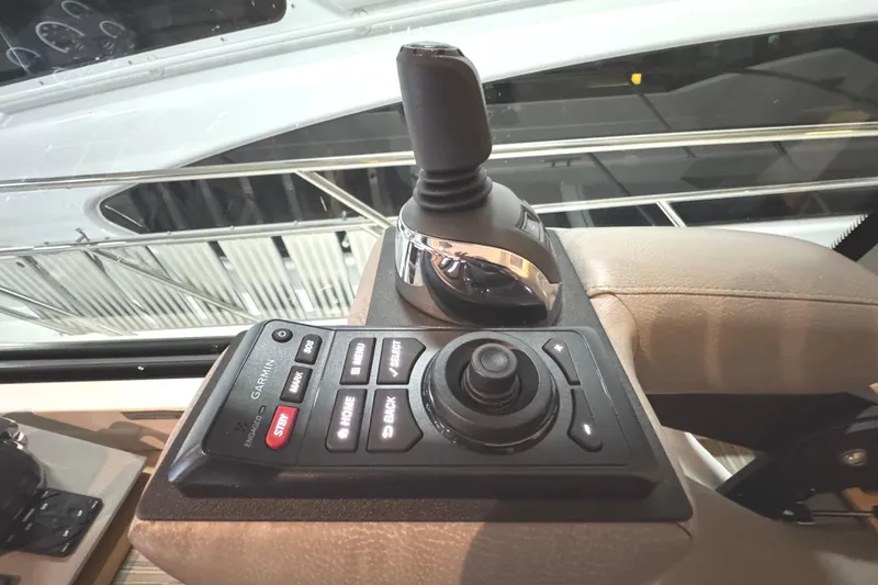 Slide: The Image of Control panel of 2020 Tiara Yachts C49 Coupe with joystick and Garmin interface. - 20