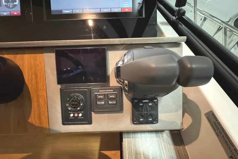 Slide: The Image of Control panel of 2020 Tiara Yachts C49 Coupe featuring Volvo Penta throttle and display. - 21