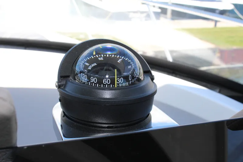 Slide: The Image of Compass on 2020 Tiara Yachts C49 Coupe dashboard, indicating direction. - 22