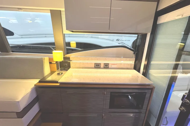 Slide: The Image of Modern interior of 2020 Tiara Yachts C49 Coupe with sleek cabinetry and countertop. - 28