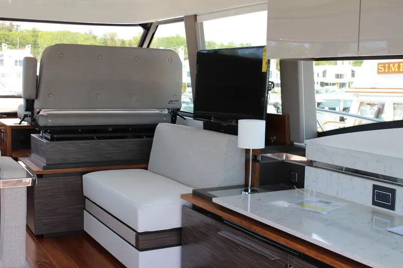 Slide: The Image of Interior of 2020 Tiara Yachts C49 Coupe, featuring modern seating and sleek design elements. - 29
