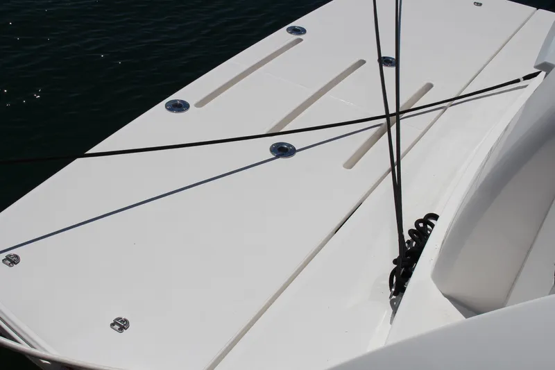 Slide: The Image of 2020 Tiara Yachts C49 Coupe deck with sleek design and mooring lines. - 3