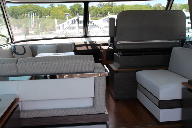 Slide: The Image of Interior of 2020 Tiara Yachts C49 Coupe, featuring modern seating and elegant design. - 30