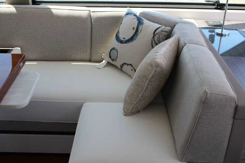 Slide: The Image of Luxurious seating area in 2020 Tiara Yachts C49 Coupe with decorative pillows. - 32