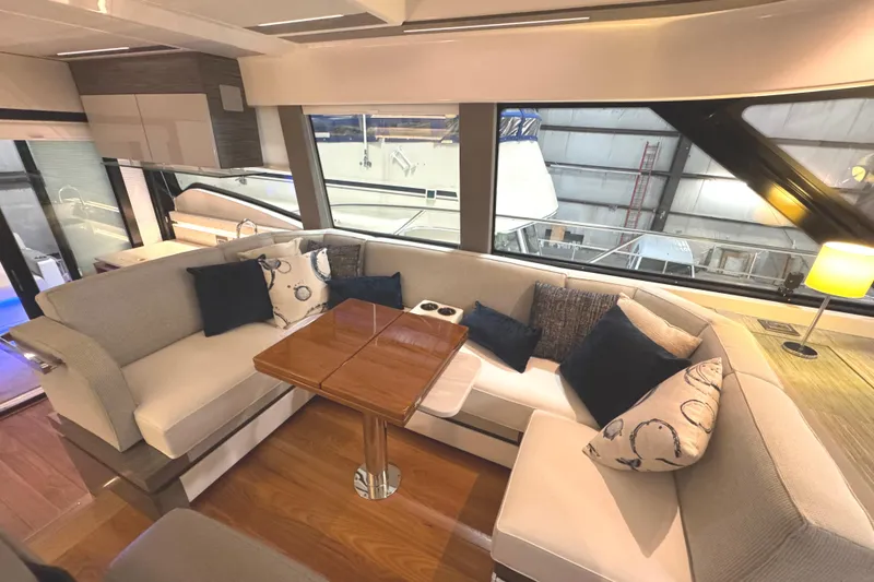 Slide: The Image of Luxurious interior of 2020 Tiara Yachts C49 Coupe with elegant seating and wooden table. - 34