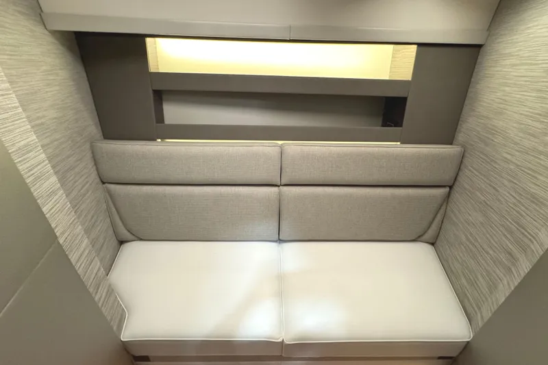 Slide: The Image of Modern interior seating in 2020 Tiara Yachts C49 Coupe, featuring sleek design and neutral tones. - 39