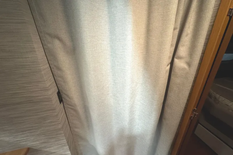 Slide: The Image of Curtained interior of 2020 Tiara Yachts C49 Coupe, showcasing elegant design details. - 42