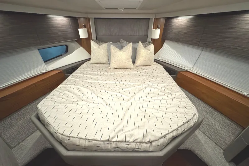 Slide: The Image of Luxurious bedroom interior of 2020 Tiara Yachts C49 Coupe with modern design and cozy bedding. - 43